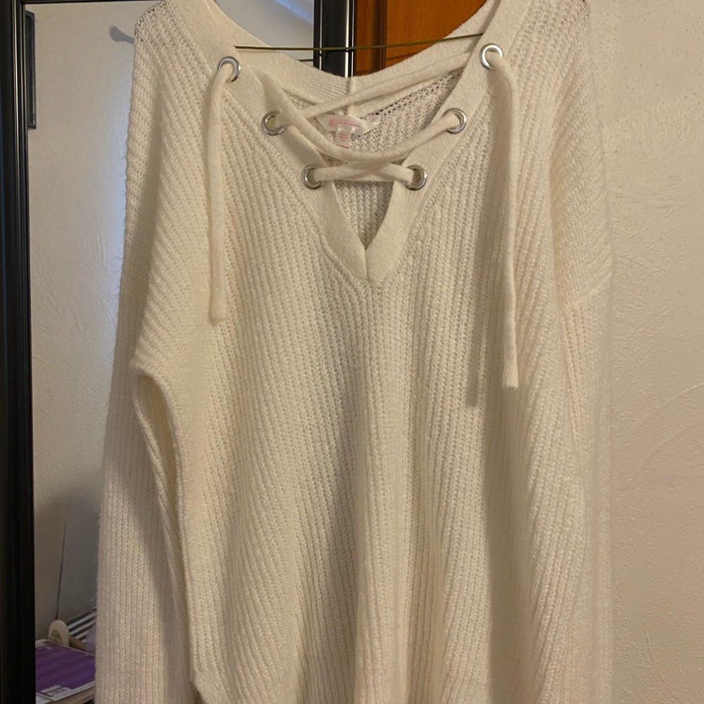 Cream colored lace up sweater